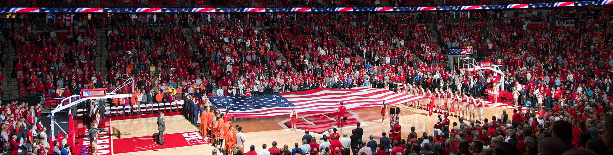 Photo of UW-Madison Basketball game at the Kohl Center during the National Anthem.